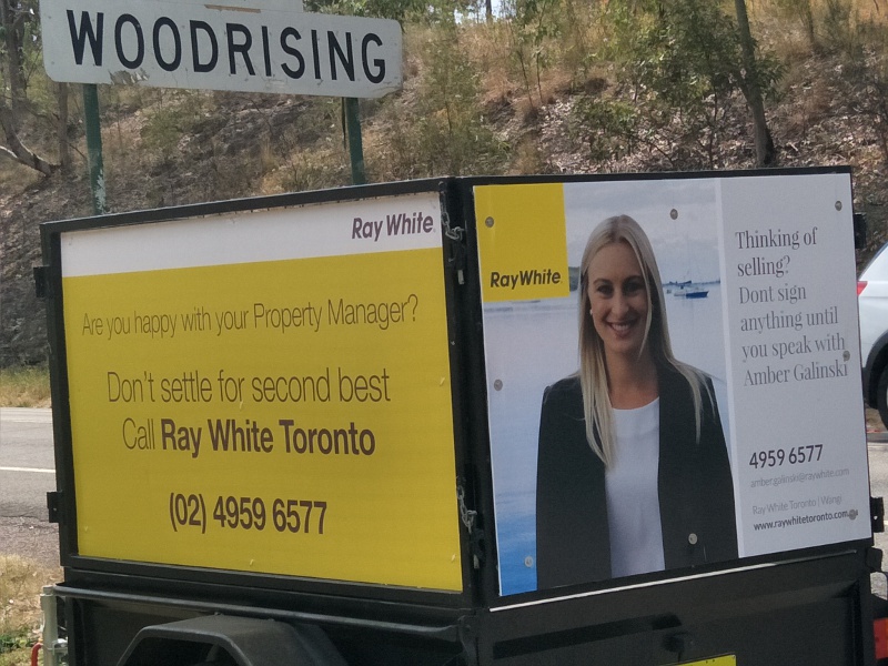 Woodrising a sign for Toronto Ray White Amber Agent