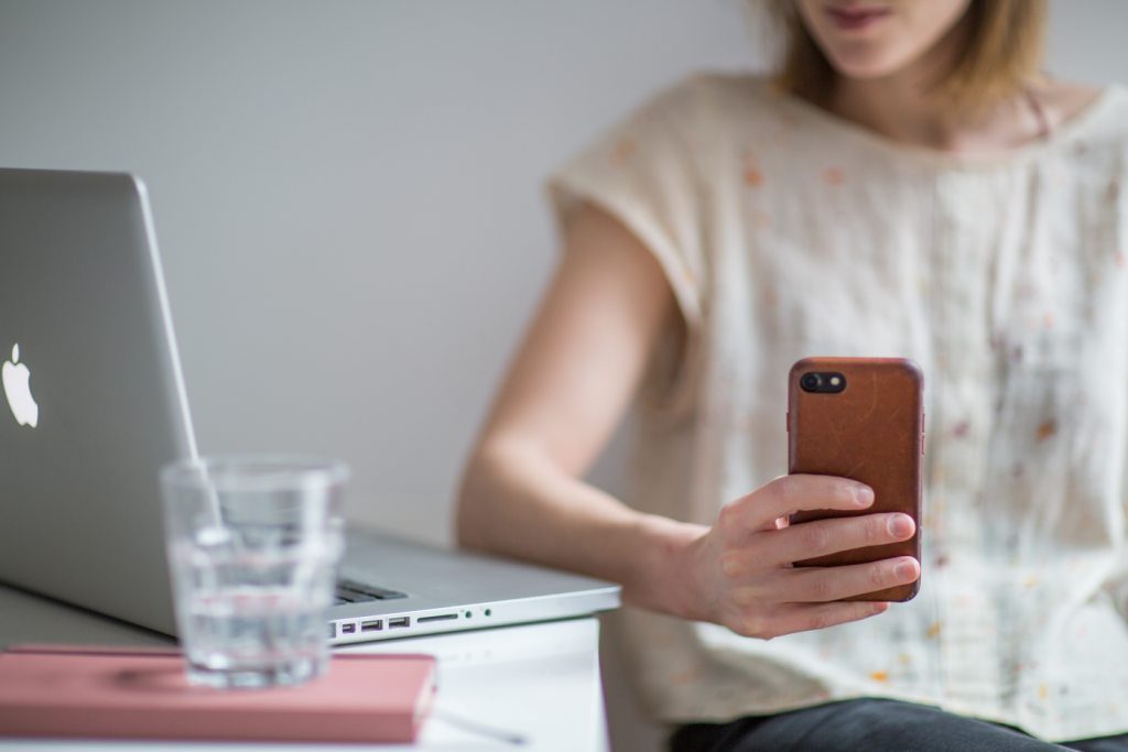 woman using mobile to learn online digital marketing social media training course study