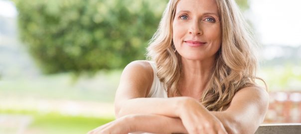 smiling woman using online quickbooks and xero accounting software